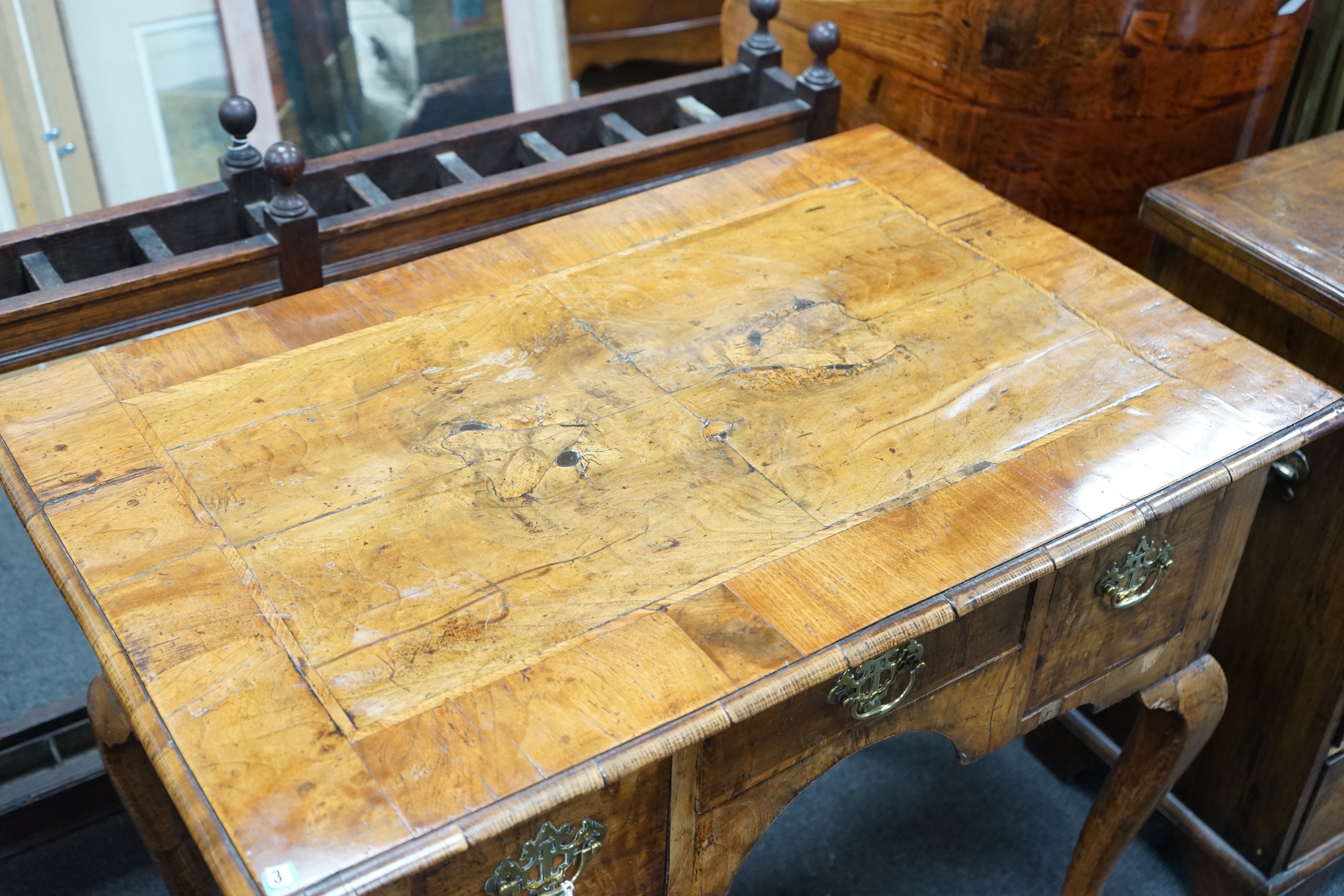 A George I walnut lowboy with quarter veneered top, width 87cm, depth 55cm, height 74cm